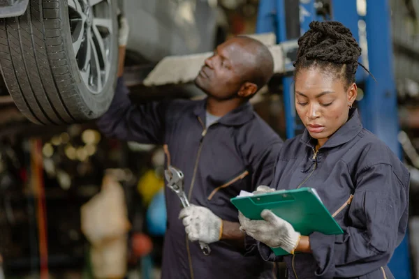 garage mechanic team working car auto service black african people professional worker together