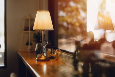 Table lamp on wooden counter bar classic luxury interior home and cafe decoration
