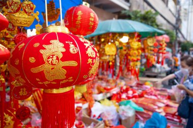 Yaowarat street during Chinese New Year festival celebrates holidays in Chinese culture shop sale red china traditional lantern clothes: 19 January 2023, Bangkok, THAILAND.
