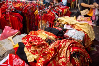 Yaowarat street during Chinese New Year festival people shopping red chinese style clothes or qipao: 19 January 2023, Bangkok, THAILAND.