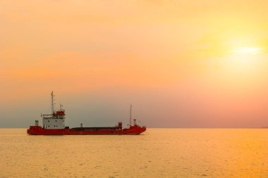 Transport cargo boat ship with sunset sea ocean shipping for import export industry scene view