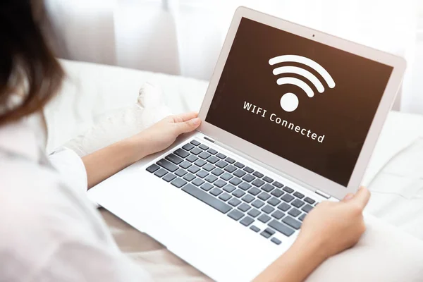 People using laptop connect to Internet using WIFI access point home network system