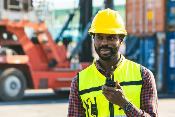 stock image african black male worker foreman work cargo control loading operator in container shipping dock yard