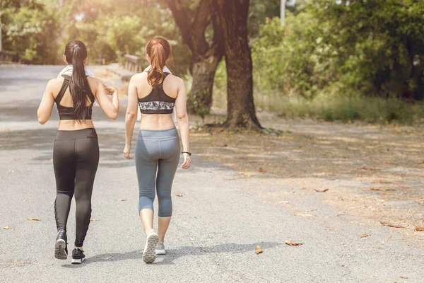women friend walking together outdoor relax leisure for sport recreation in the morning