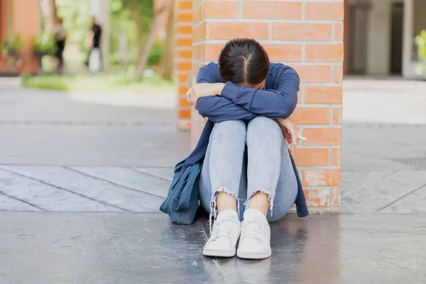 Teen girl sad cry from fail exam. University Student tired sitting down sleep or mental sick
