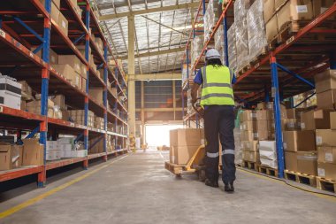 warehouse worker using hand pallet trucks loading cargo for shipping logistics depot products from shelf storage clipart