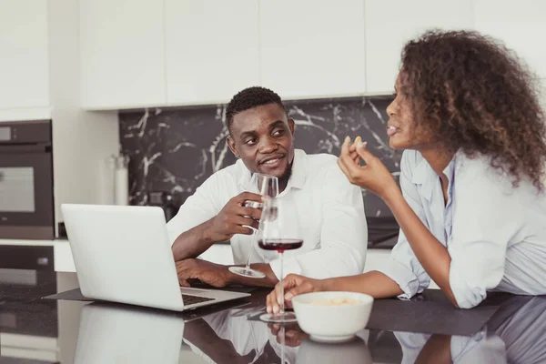 Black people couple wine drink dates talking together relax meeting in kitchen home vintage color tone