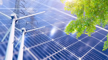 Temiz karbonsuz ve sürdürülebilirlik enerji üretim teknolojisi konsepti. Güneş paneli rüzgar türbini ve elektrik hattını yeşil bitki ağacıyla örtüyor.