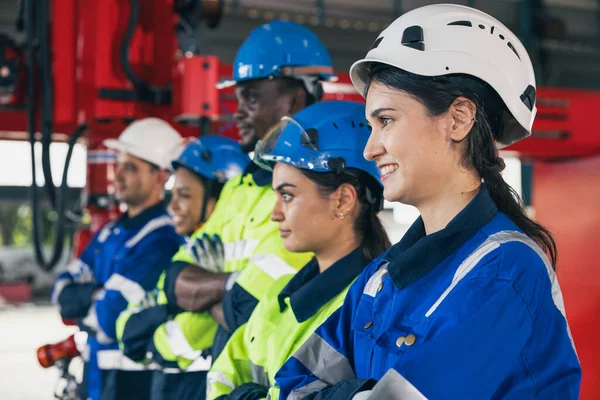 Group of engineering team happy worker diversity technician. woman engineers standing arm crossing in assembly plant. Industry staff working people teamwork concept.