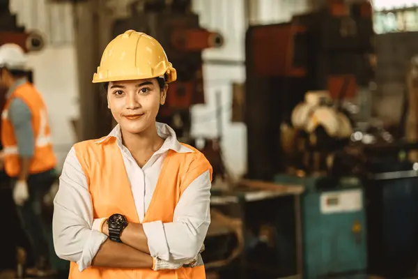 Happy women engineer Asian worker female work in factory portrait smile standing arm fold confidence look