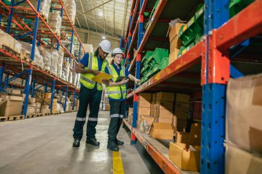 warehouse worker teamwork working help assist young new worker checking products stock for shipping order. clipart