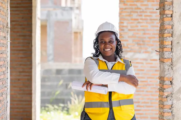 Portrait smart success black women worker african female work in construction industry happy smile in construction site.