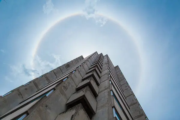 Sun Halo, Nature phenomenon of sunny light refraction with cloud to circle 360 degree rainbow with city building