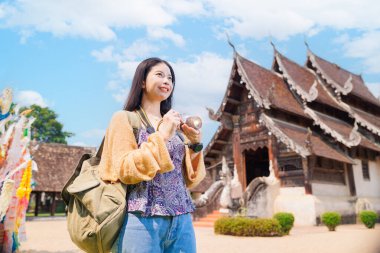 Wat Ton Kwen, Beautiful Asian female Photographer Travel Temple in Chiangmai Province Northern of Thailand. clipart