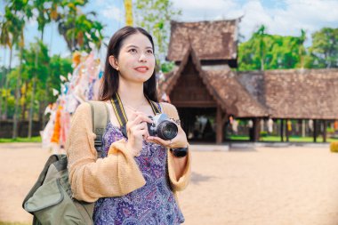 Wat Ton Kwen, Beautiful Asian female Photographer Travel Temple in Chiangmai Province Northern of Thailand. clipart