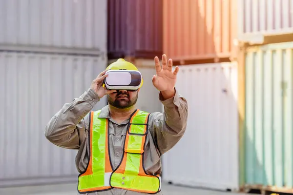 stock image Worker Using VR Vision Pro Technology Equipment Headset Device Work at Container Yard Construction site Innovation in Logistics Industry