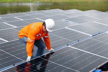 Professional Engineer Service Floating Solar Panel. Worker Maintenance Cleaning Replacing Solar Panel. Solar photovoltaic panel system in Industry lake. Saving Energy with Clean Power. clipart