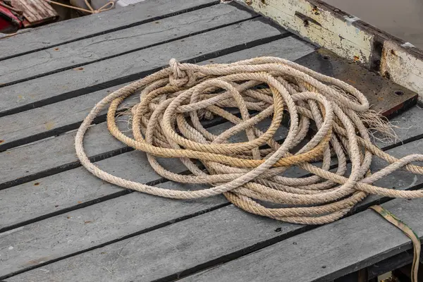 stock image Boat rope, Mooring Line heavy duty old grunge used weathered for secure parking the boat at pier dock.