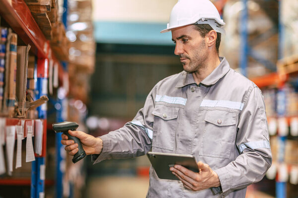 Warehouse worker working check inventory at shelf with barcode scan, Cargo employee staff in duty storage warehouse building