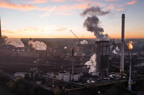 Metallurgical Plant in North Rhine-Westphalia at dawn. In addition to a steel mill, it operates a coke plant, blast furnaces, a power plant and a sinter plant.