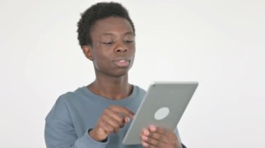 Video Call on Tablet by Casual African Man on White Background