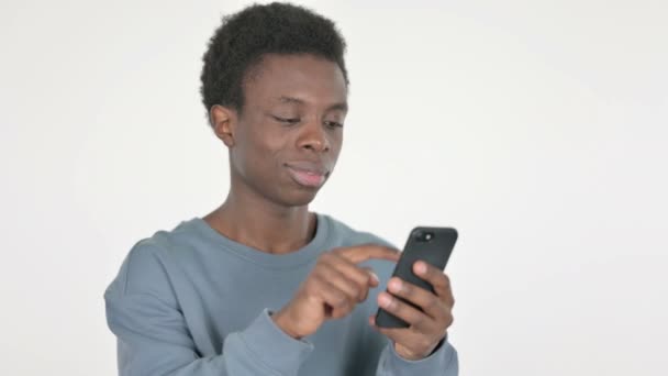 Casual African Man Celebrating Success Smartphone White Background — Vídeo de Stock