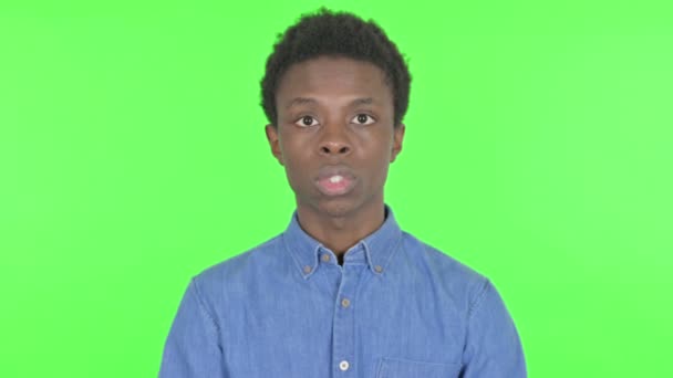 Shocked Casual African Man Feeling Surprised Green Background — Video