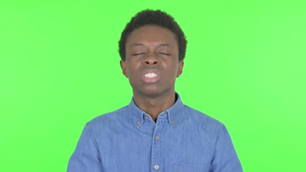 Screaming Casual African Man Feeling Crazy Green Background — Video Stock