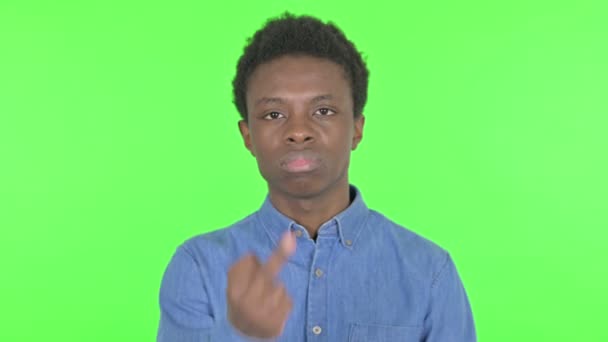 Upset Casual African Man Showing Middle Finger Green Background — Stockvideo