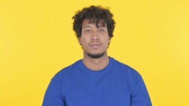 Denying Casual African Man Rejecting Idea on Yellow Background