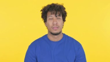 Casual African Man having Toothache on Yellow Background