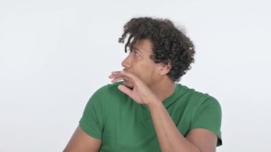 Casual African Man Feeling Scared and Frightened on White Background