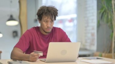 Young African Man Unable to make Online Payment on Laptop