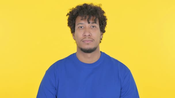 Serious Casual African Man Yellow Background — Vídeos de Stock