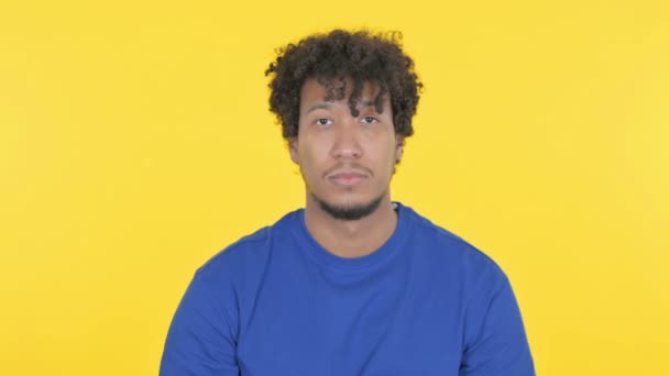 Casual African Man Finger Lips Silence Yellow Screen — Video Stock
