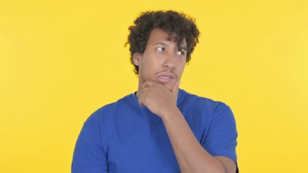 Brainstorming Casual African Man Thinking Yellow Background — Stock Video