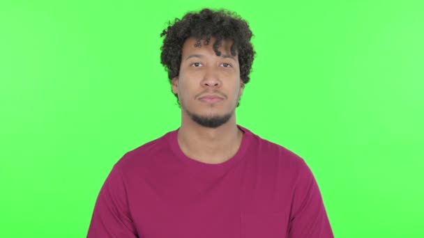 Serious Casual African Man Green Background — Stockvideo