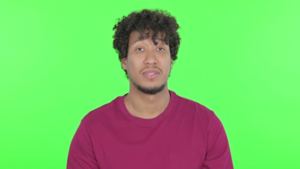 Casual African Man Giving Flying Kiss Green Background — Video