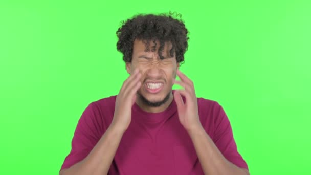Casual African Man Having Headache Green Background — Wideo stockowe