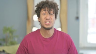 Excited Young African Man Celebrating Success, Feeling Happy