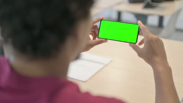 Close Young African Man Watching Smartphone Green Screen — Wideo stockowe