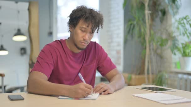 Young African Man Writing Letter Office — Stock video