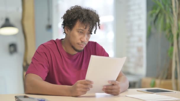 Young African Man Working Documents Office Paperwork — Video