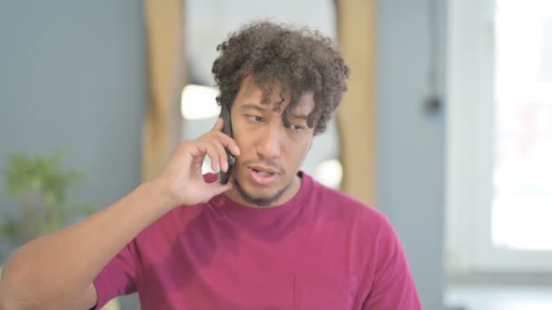 Young African Man Talking Phone Discuss Work — Stockvideo