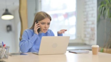 Angry Young Woman Talking on Smartphone in Tension