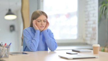Depressed Young Woman with Headache, Migraine in Office