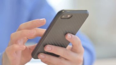 Close up of Female Hand Browsing Internet Smartphone