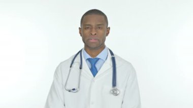Serious Young African Doctor on White Background