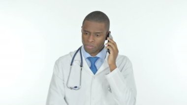 Young African Doctor Talking on Phone on White Background