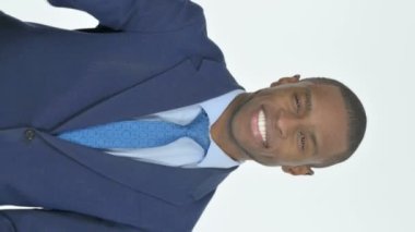 Vertical Video of Young African Businessman with Victory Sign on White Background